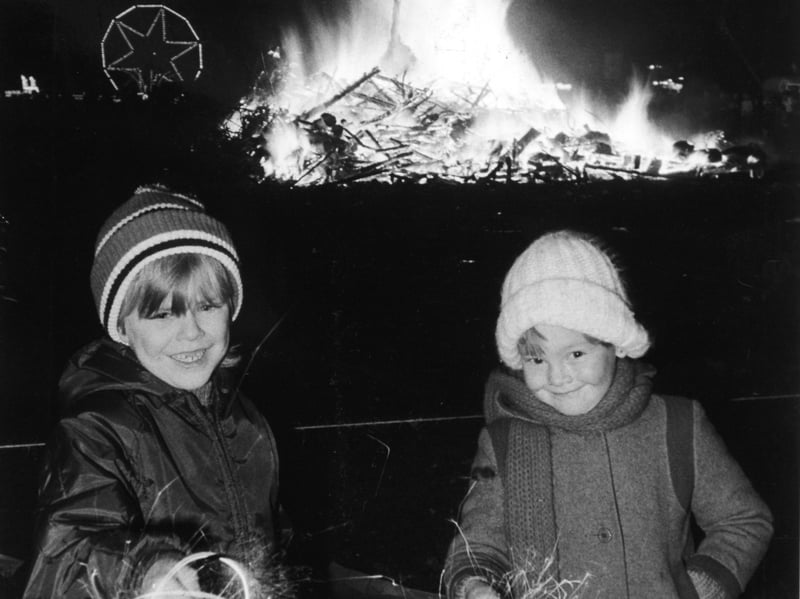Mark, aged 7, and Louise Brownridge, 5, with their sparklers at the East End Community Association Bonfire Night celebrations in November 1981