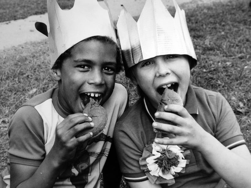 Steven Goodman, aged eight, left, and Mark Richards, also eight, tuck into food during a party on Hemingways Street, Hunslet, to celebrate the royal wedding of the Prince and Princess of Wales in July 1981