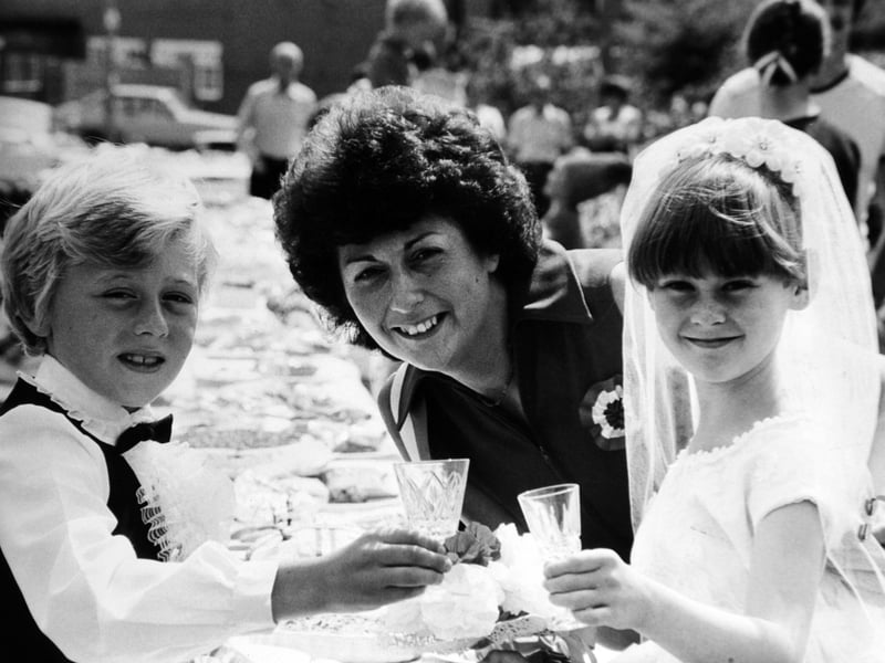Charles and Diana, alias Antony Blore and Claire Allison, both aged eight, of Moorgate Close, with Pam Blore, who made Claire's outfit from her own wedding dress. They were celebrated the wedding of the Prince and Princess of Wales in July 1981.