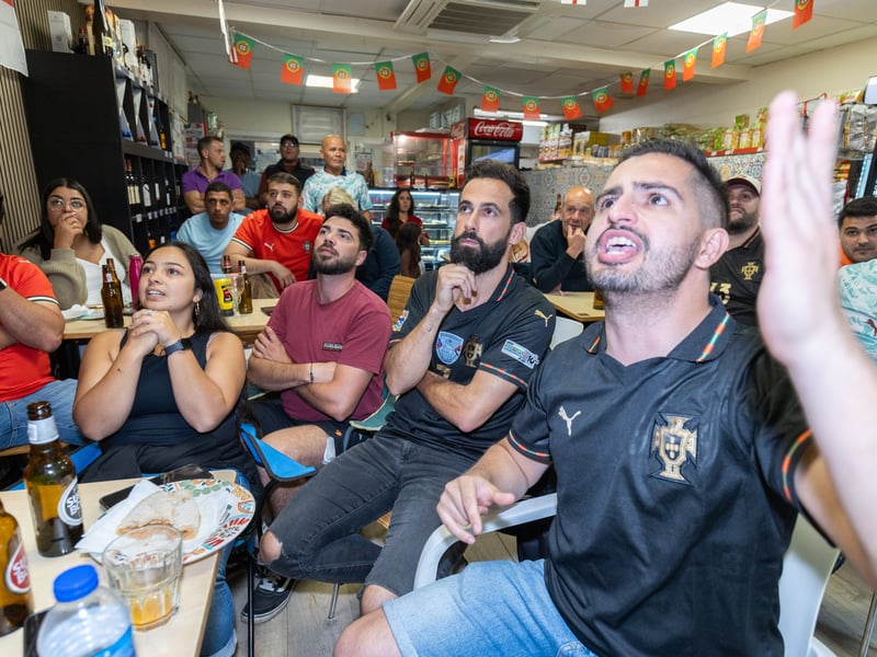 Portugal fans packed into the café and deli on Cosham High Street to cheer their team on against DR Congo.