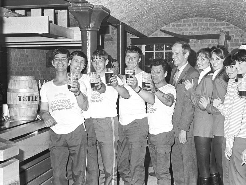 Competitors in the York Bonding Warehouse barrel race raise their glasses in July 1981