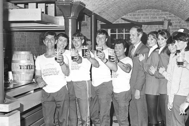 Competitors in the York Bonding Warehouse barrel race raise their glasses in July 1981
