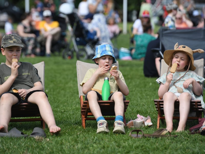 Children enjoy ice creams in the hot weather.