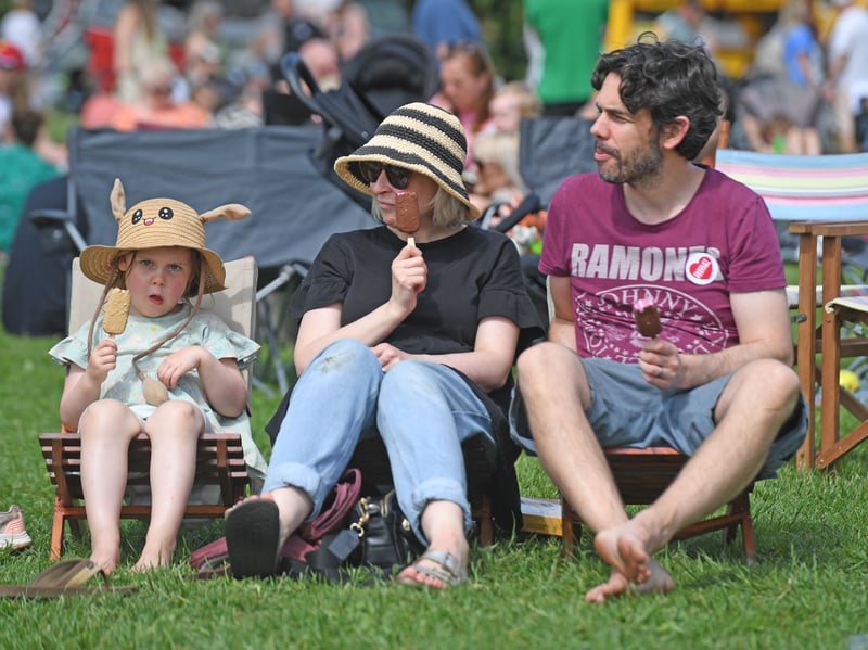 Staying cool. This family enjoy an ice cream.