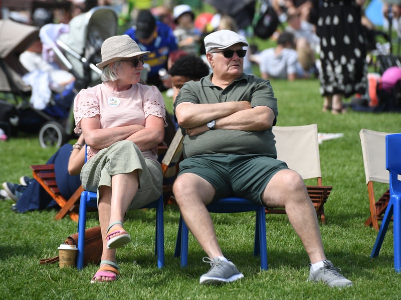 Visitors enjoy the band on stage.