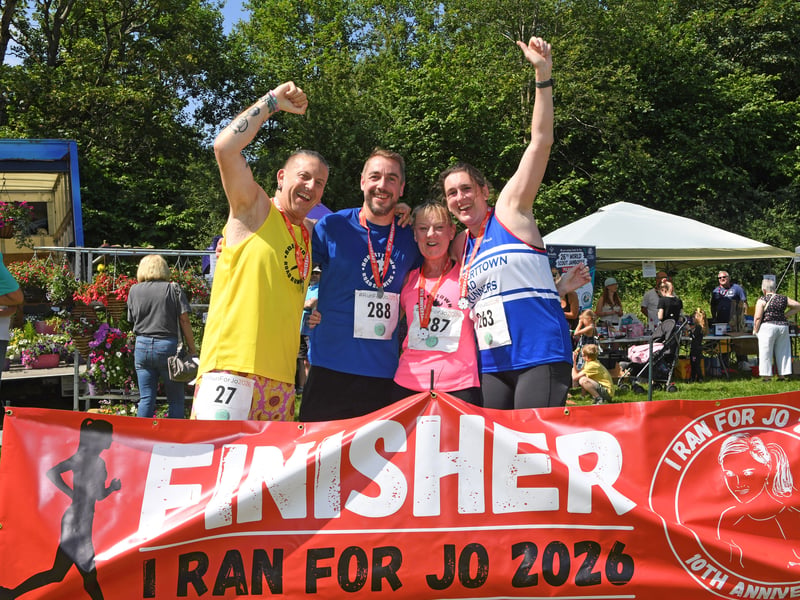 Roberttown Road Runners celebrate finishing the race.