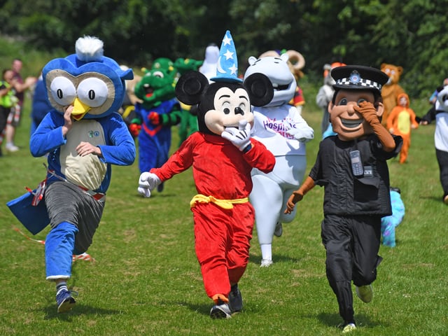 The mascots make a dash for the line.