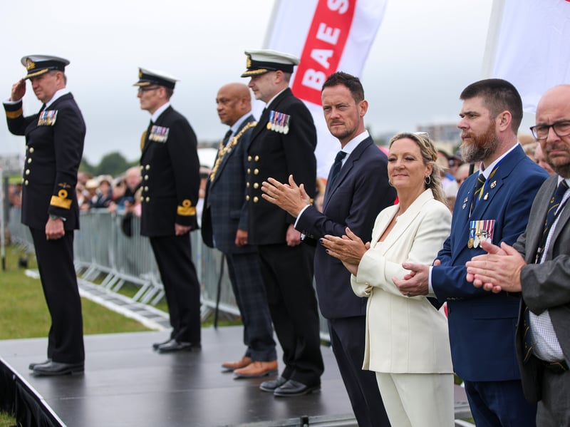Deputy Lieutenant of Hampshire, Cdre Richard Powell, left, takes the salute as the city's MPs Stephen Morgan and Amanda Martin look on.