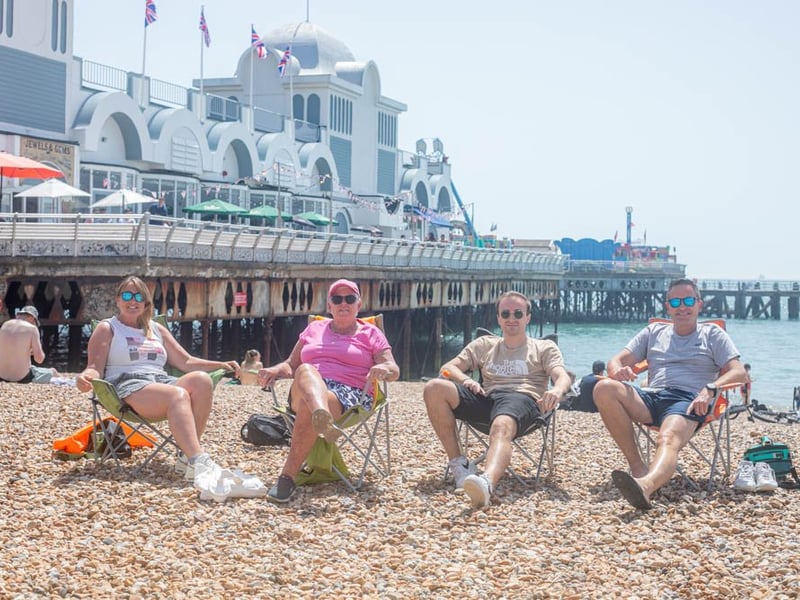 From left,  Lyndsey Jardine, Anne Woolley, Jack Woolley and Steve Maynard soaking in the sun near South Parade pier.