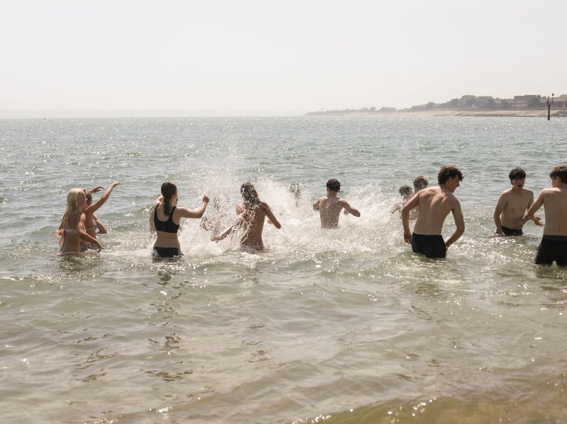 People playing in the sea off Southsea beach.