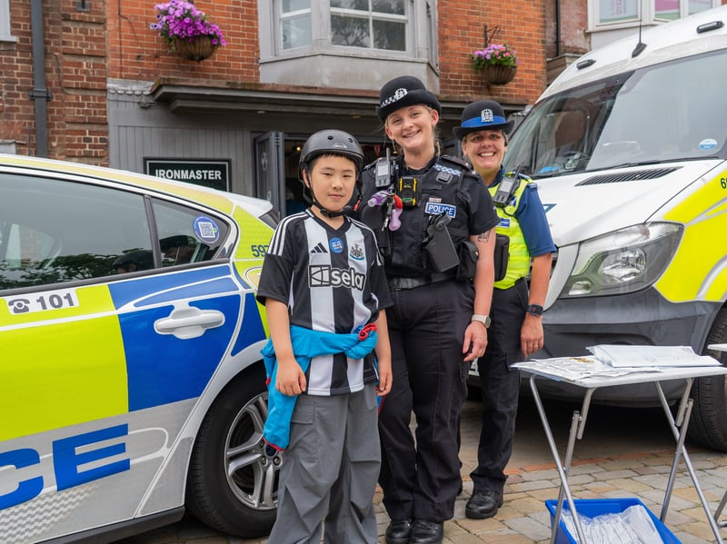 Pictured is Maverick and two HIOW Police Officers. Pictured by Alec Chapman