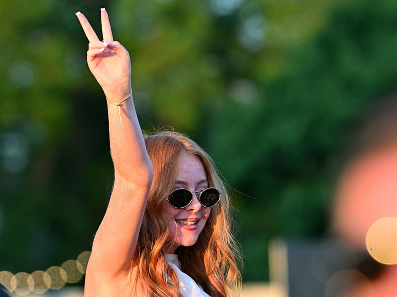 A fan greets Lewis Capaldi's arrival on stage.