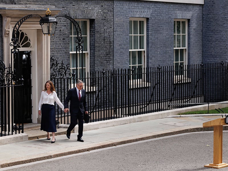 Sir Keir Starmer and his wife, Victoria Starmer, walk out of 10 Downing Street ahead of his resignation announcement.