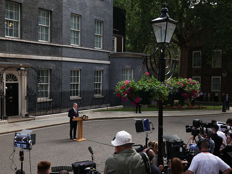 Prime Minister Keir Starmer prepares to address the assembled journalists.