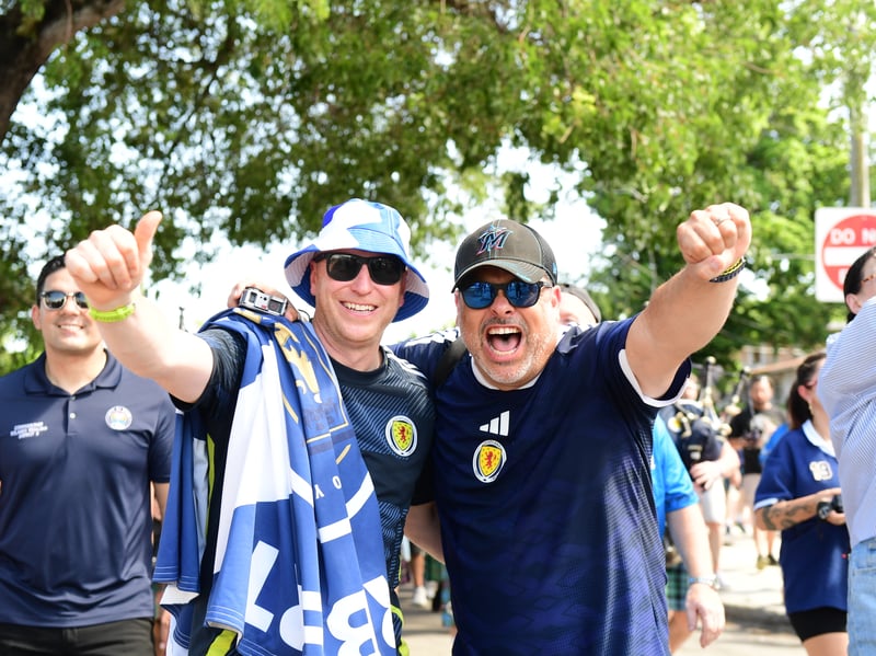 The Tartan Army march to LoanDepot Park in Miami. 