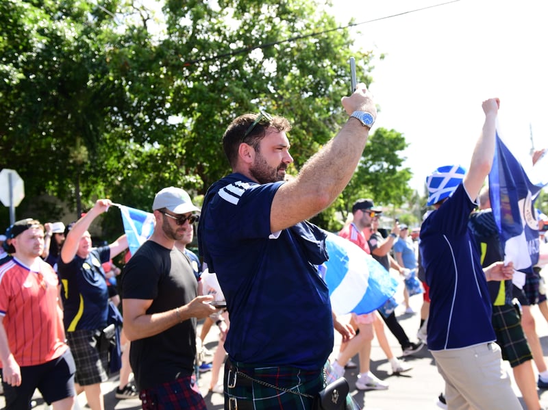 The Tartan Army march to LoanDepot Park in Miami.
