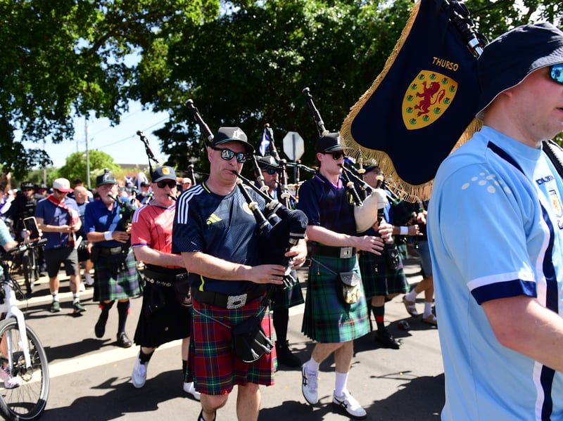 The Tartan Army march to LoanDepot Park in Miami. 