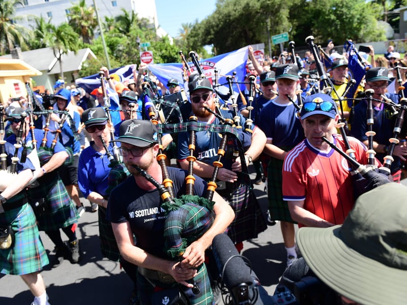 The Tartan Army march to LoanDepot Park in Miami. 