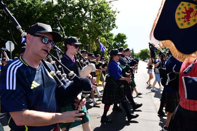 The Tartan Army march to LoanDepot Park in Miami.