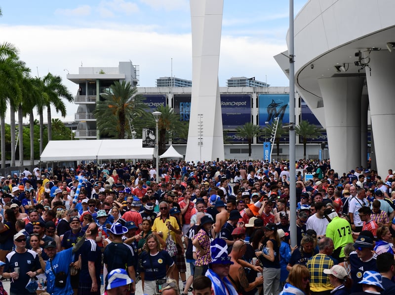 The Tartan Army march to LoanDepot Park in Miami.