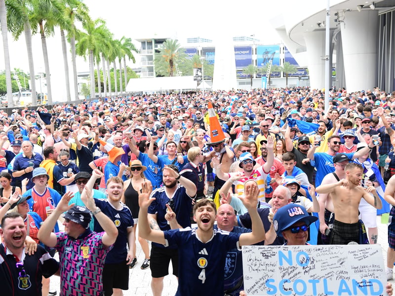The Tartan Army march to LoanDepot Park in Miami. 