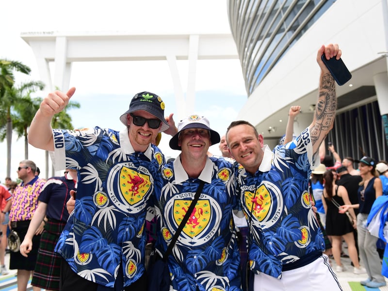 The Tartan Army march to LoanDepot Park in Miami.