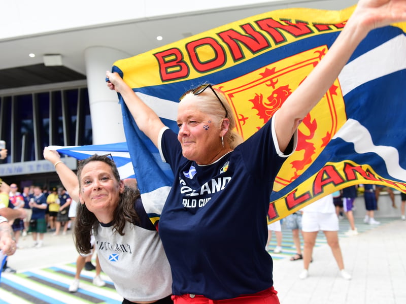 The Tartan Army march to LoanDepot Park in Miami.