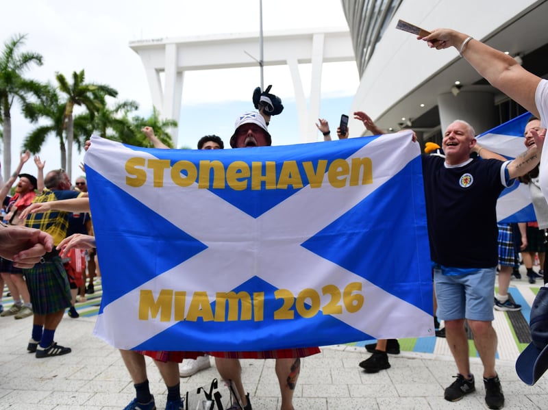 The Tartan Army march to LoanDepot Park in Miami. 