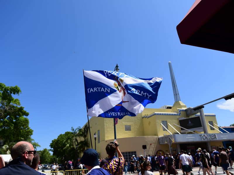 The Tartan Army march to LoanDepot Park in Miami. 