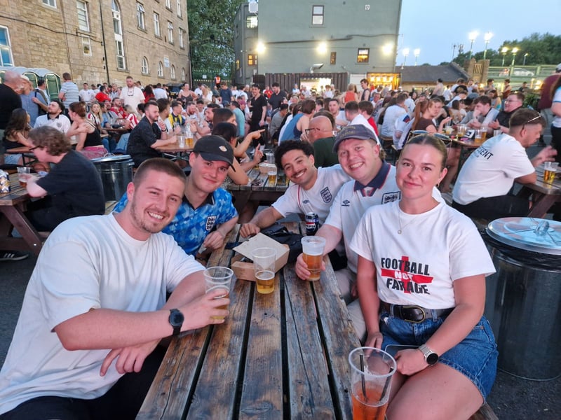 An array of white football shirts packed into the pub as England fans watched on with anticipation.