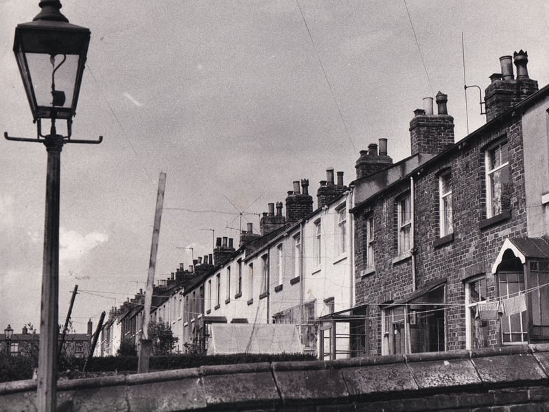 Thed old gas lamp frames the cottages at Playground in May 1974.