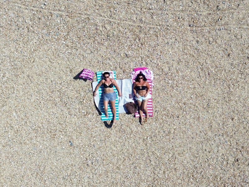 Hot Weather pictures in Southsea, Portsmouth on Wednesday 24th June 2026
Pictured: Helen Hills and Franchesca Bradbeer enjoying the sun on Southsea  beach
Picture: Habibur Rahman
