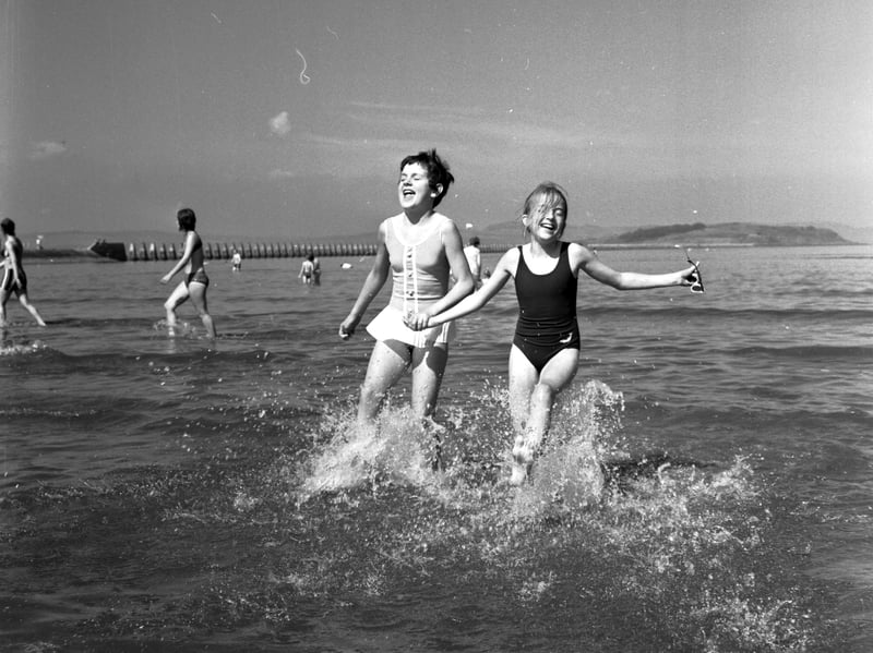 Two girls playing in the water at Cramond in August 1970.
