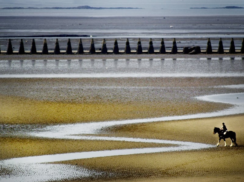 A lone horse rider on Cramond Beach in 2009.