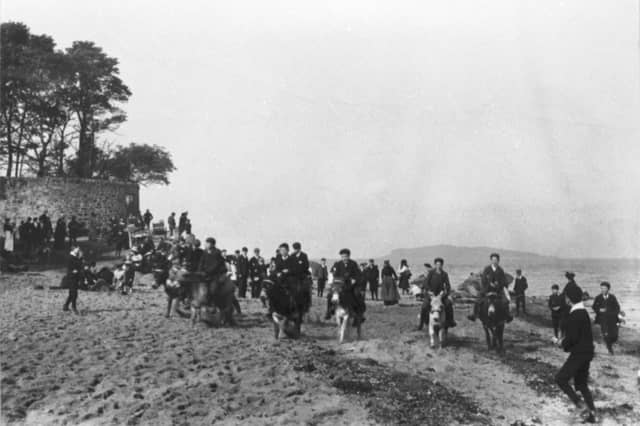 Edinburgh holidaymakers taking part in the donkey races on Cramond Beach in around 1900.
