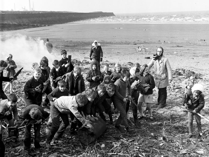 Children and volunteers cleaning up Cramond beach in April 1970.