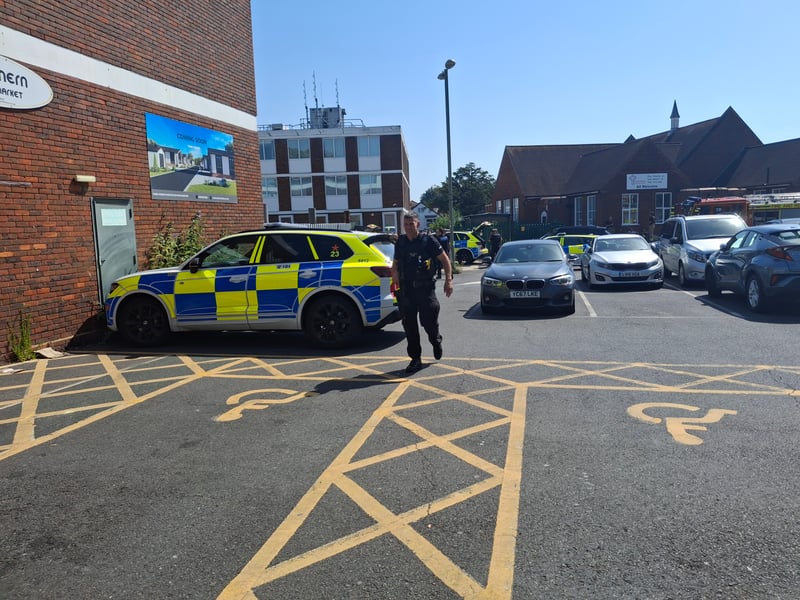 Armed police and fire crews have been deployed to Portchester Precinct, with part of the area "sealed off" from the public.