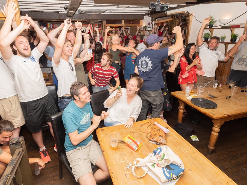 Fans react as England win their quarter final match against Sweden in the 2018 World Cup 