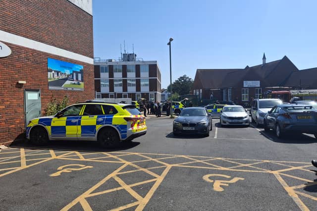 Armed police and fire crews have been deployed to Portchester Precinct, with part of the area "sealed off" from the public.