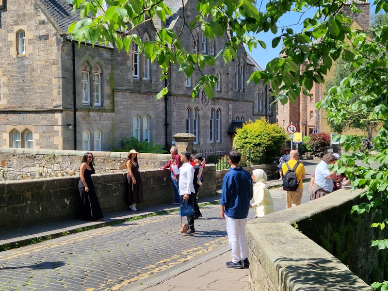 The Dean Village was a popular backdrop for pictures as people posed in the sun