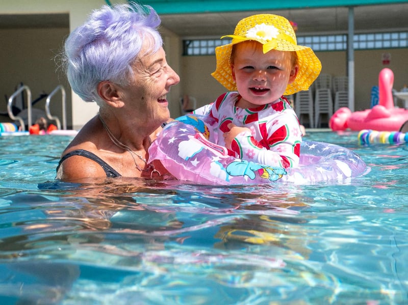 Rosie Sloan, 18 months, with her grandmother Sandra Sloan, at Cumnock open-air swimming pool in East Ayrshire.