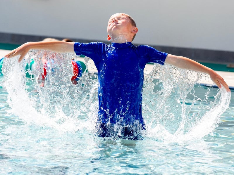 Wallace Ferrol, aged 8, cools off from the hot weather at Cumnock open-air swimming pool.