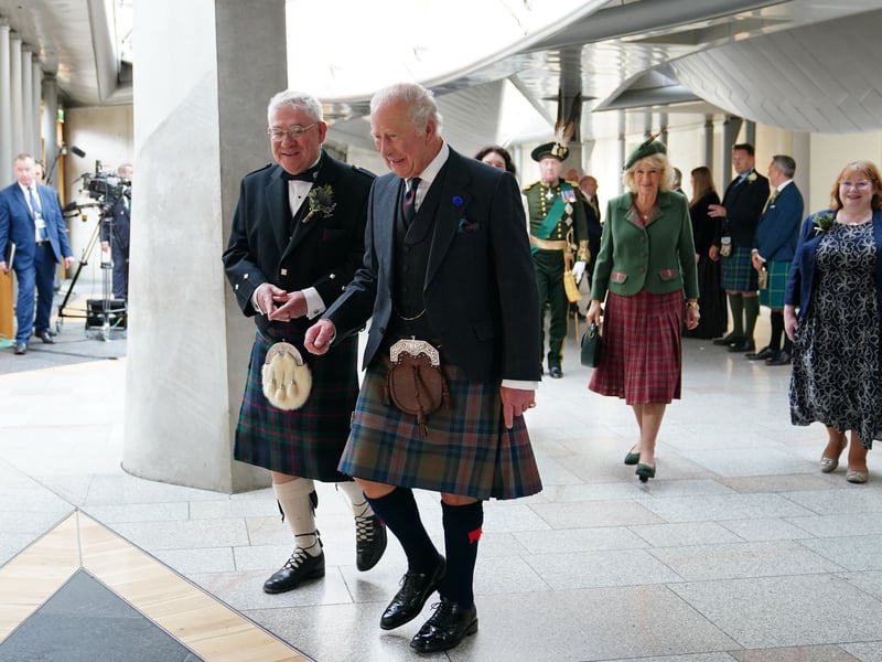 Presiding Officer Kenneth Gibson (left) and King Charles III and Queen Camilla arrive for the opening of the seventh session of the Scottish Parliament in Edinburgh.