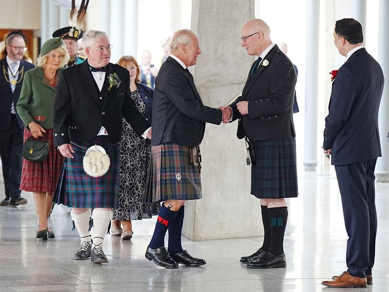 King Charles III is greeted by First Minister and SNP leader John Swinney (second right), as Presiding Officer Kenneth Gibson (left) and Scottish Labour leader Anas Sarwar (right) look on in the Garden Lobby ahead of the opening of the seventh session of the Scottish Parliament in Edinburgh.