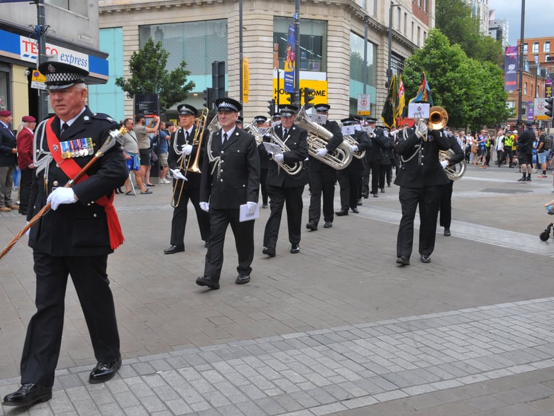 The West Yorkshire Police Band lead the parade.