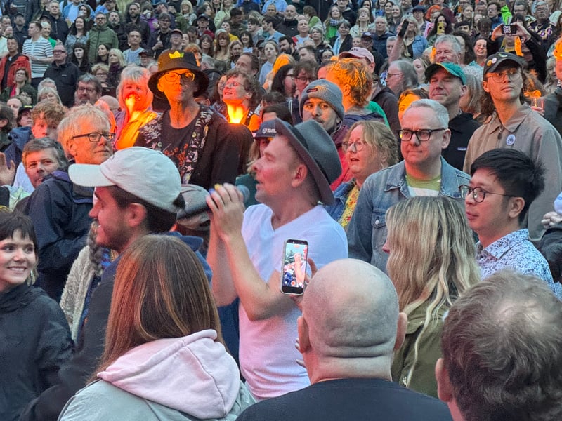 Lead singer Stuart Murdoch getting up close and personal with fans during the set.