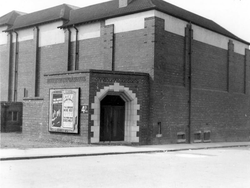 Back view of Star Cinema in May 1938. The poster advertises current film, Joan Crawford in 'The Bride Wore Red' and Lewis Stone in 'The Man Who Cried Wolf'.