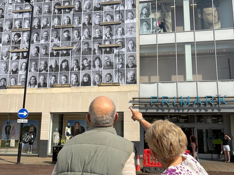 This pair were captured admiring the photos. 