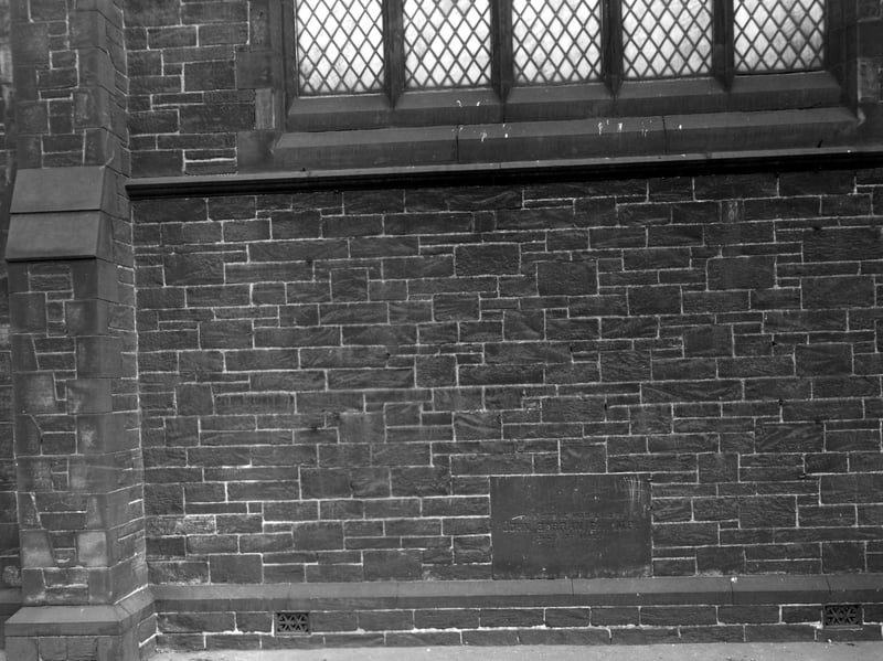 A view of the dedication stone of Roscoe Place Methodist Chapel on Roscoe Road. The stone was laid on the July 17, 1882 by John Barron M.P. Also visible is the wall's intricate brickwork and a leaded window. Pictured in November 1952.