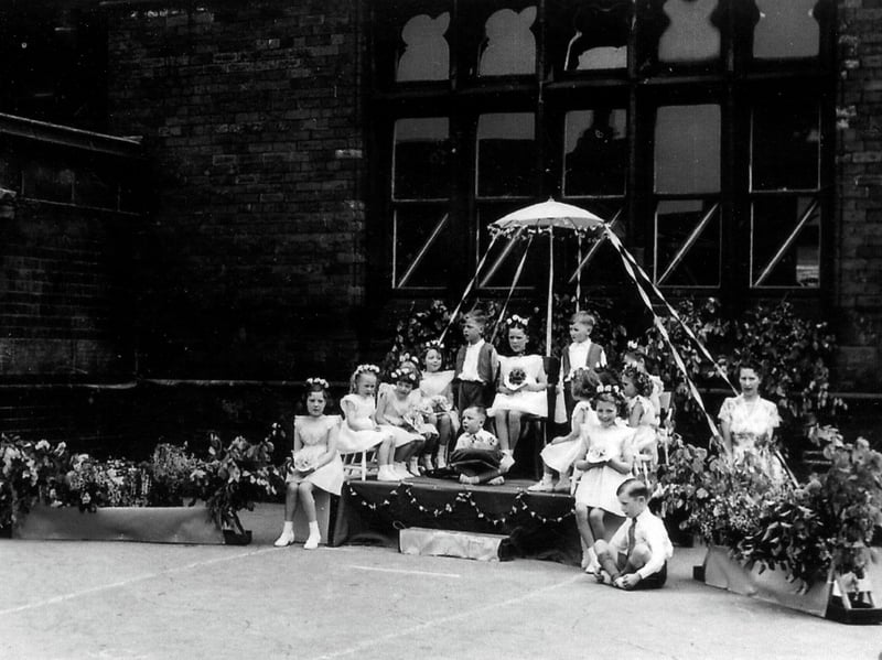 May Day celebrations are taking place at Sheepscar Council School in May 1953.
